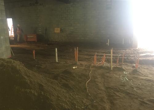 Underground Electrical Work Finished and Soil Backfilled Inside New Locker rooms  